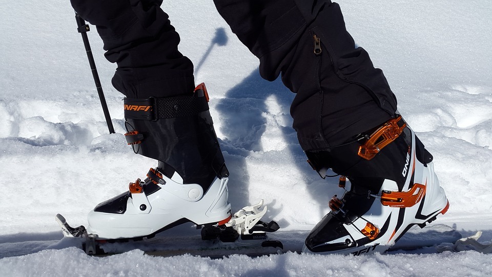 a pair of ski boots on snow