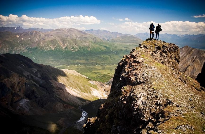 Hikers sightseeing the Wrangell Range