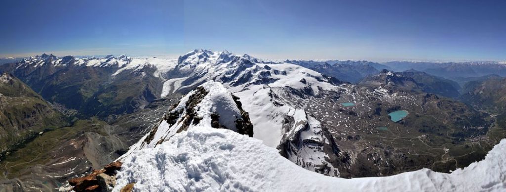 Matterhorn’s view from the summit towards Monte Rosa with the valleys of Mattertal (left) and Valtournenche (right)