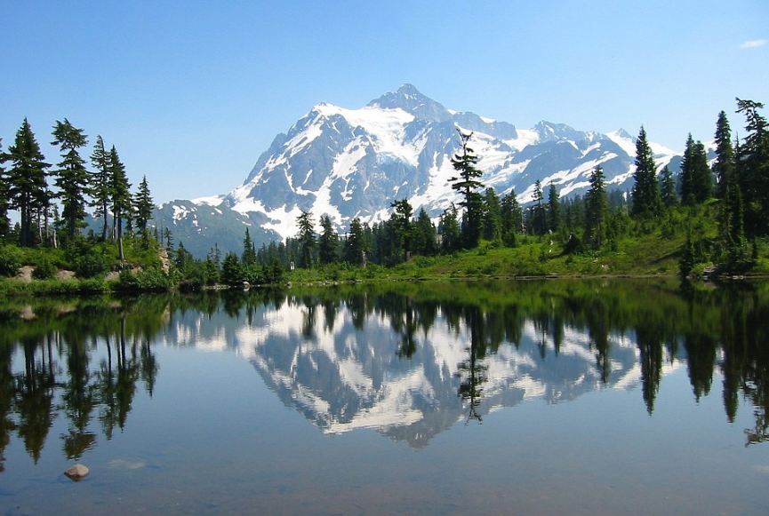 Mount Shuksan reflected into a crystal clear lake