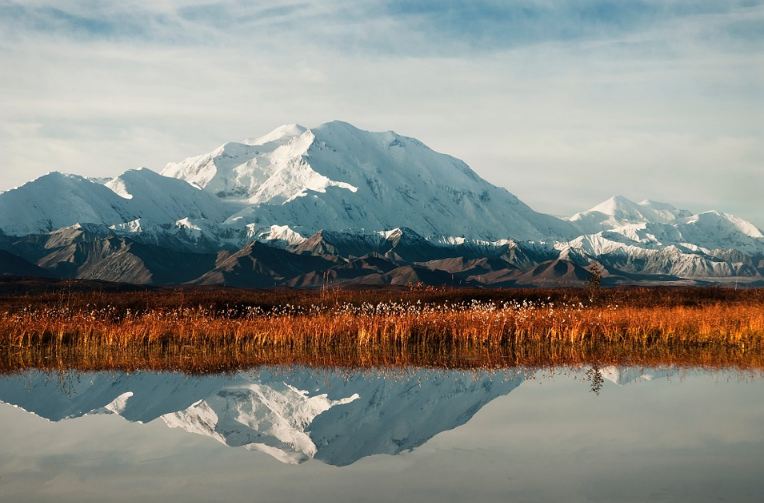 A view of Denali, reflected on a river