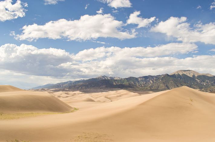 The landscape of the Great Sand Dunes with the mountains