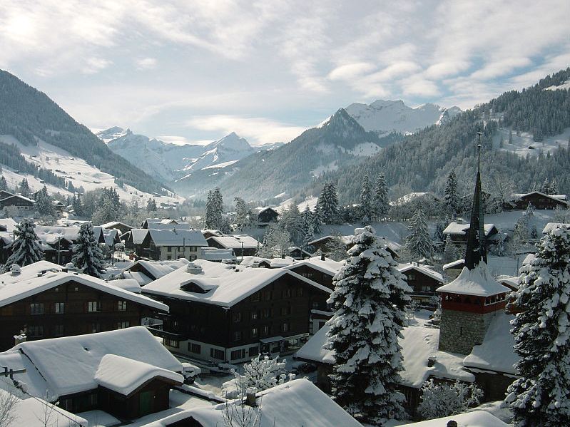 houses in Gstaad covered with snow during winter