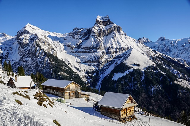three cottages in an alpine valley