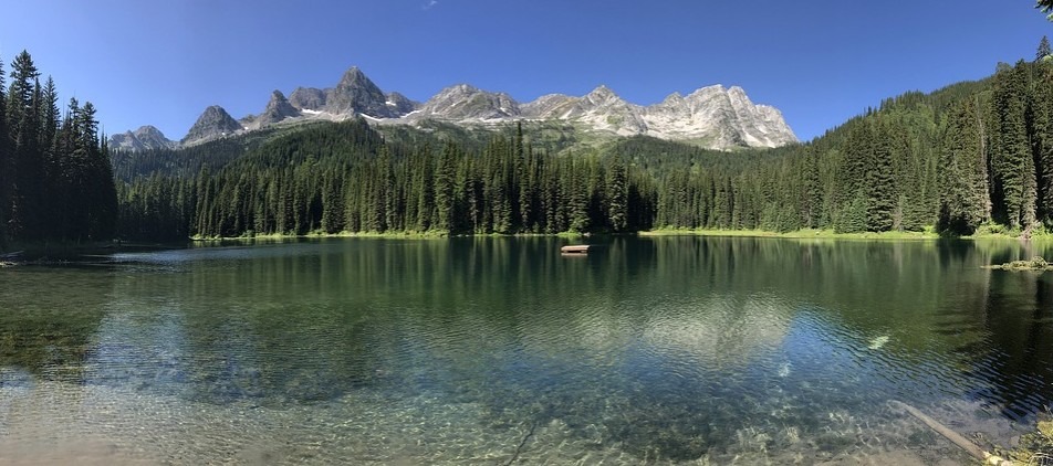 beautiful clear lake at with a view of Mount Fernie