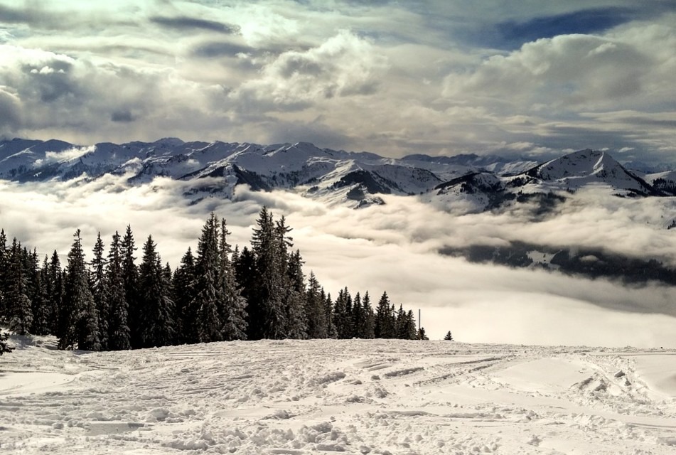 the mountains at Kitzbühel covered with snow, and thick clouds