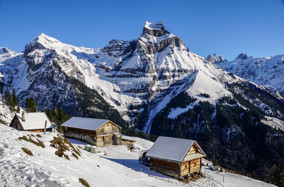 three cottages in an alpine valley