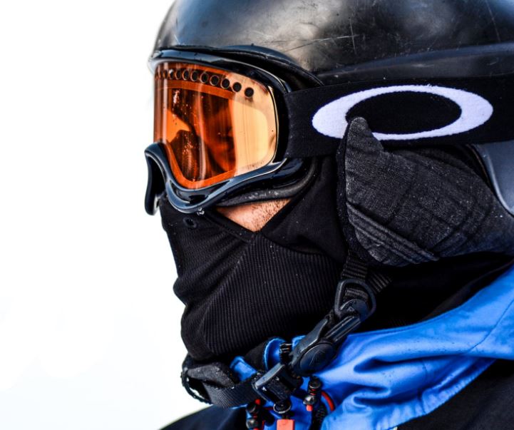 person in black goggles and black face mask 