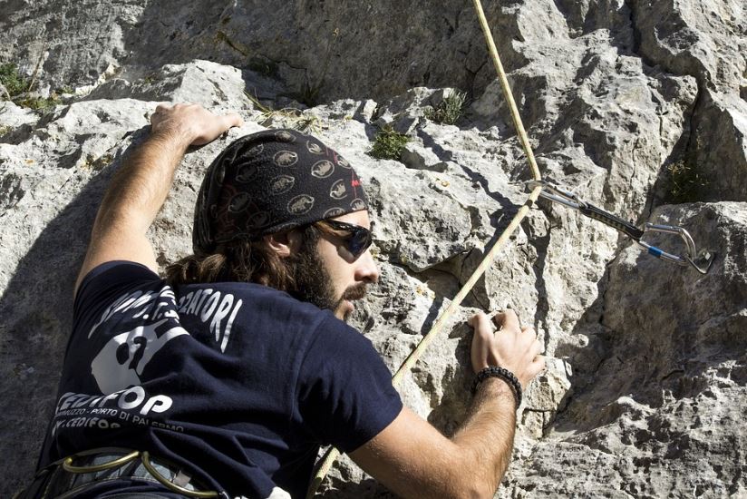 man rock climber wearing sunglasses