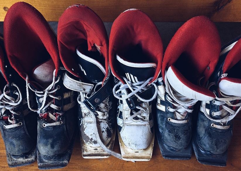 a line of worn ski boots